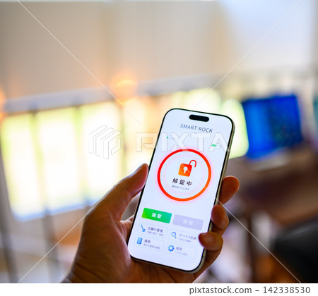 Display the unlock screen of the smart lock app on your smartphone. Display the unlock screen of the smart lock app on your smartphone. 142338530