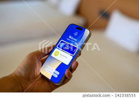 Checking into a hotel using your smartphone, app screen Checking into a hotel using your smartphone, app screen 142338555