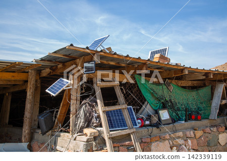 Rustic Structure with Solar Panels and Off-Grid Electronics Rustic Structure with Solar Panels and Off-Grid Electronics 142339119