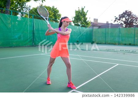 Female tennis player preparing for a backhand stroke 142339986