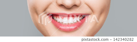 Close-Up of a Young Woman's Beautiful Smile Close-Up of a Young Woman's Beautiful Smile 142340282