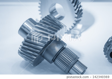 Incline scene of precision bevel gear shaft parts in dramatic blue tone lighting Incline scene of precision bevel gear shaft parts in dramatic blue tone lighting 142340369