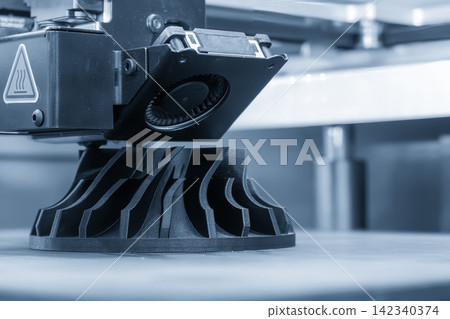Additive manufacturing process on 3D printing machine in dramatic blue tone lighting Additive manufacturing process on 3D printing machine in dramatic blue tone lighting 142340374