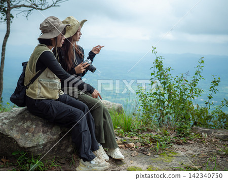 tourist with backpack hiking in forest 142340750