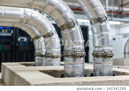 Industrial insulated pipes with metal clamps in a modern facility Industrial insulated pipes with metal clamps in a modern facility 142341298