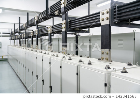 Industrial electrical distribution panels and busbars in a modern facility Industrial electrical distribution panels and busbars in a modern facility 142341563