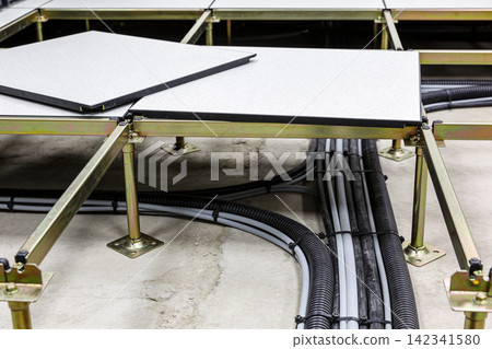 Raised access floor system with organized cabling beneath for modern infrastructure Raised access floor system with organized cabling beneath for modern infrastructure 142341580