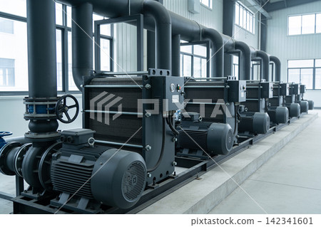 Industrial pumps and piping system in a modern factory setting 142341601