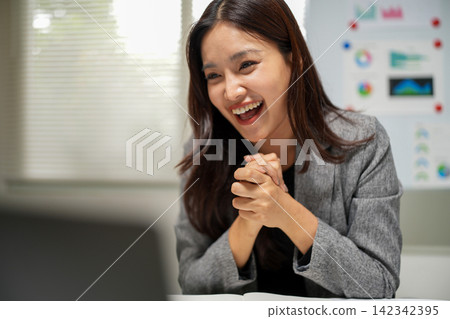 Successful Businesswoman Reacting with Surprise in Office Successful Businesswoman Reacting with Surprise in Office 142342395