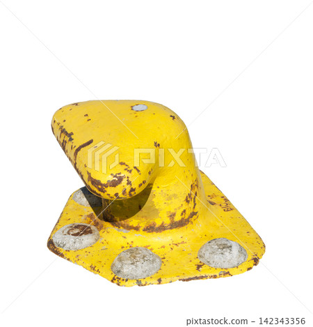 A weathered yellow bollard with rust spots and concrete anchors sits isolated A weathered yellow bollard with rust spots and concrete anchors sits isolated 142343356