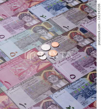 Oman, omani paper money, rial or riyal banknotes and coins as currency for exchange. Omani money Oman, omani paper money, rial or riyal banknotes and coins as currency for exchange. Omani money 142343596
