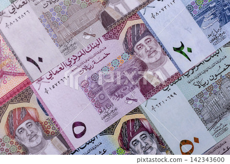 Oman, omani paper money, rial or riyal banknotes and coins as currency for exchange. Omani money Oman, omani paper money, rial or riyal banknotes and coins as currency for exchange. Omani money 142343600