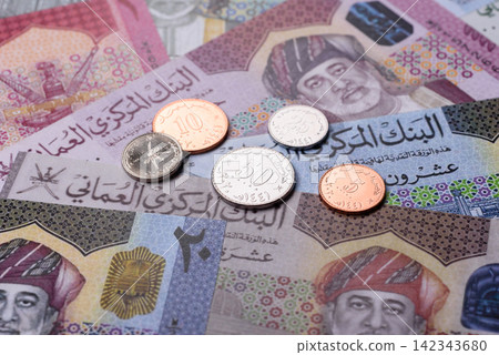 Oman, omani paper money, rial or riyal banknotes and coins as currency for exchange. Omani money Oman, omani paper money, rial or riyal banknotes and coins as currency for exchange. Omani money 142343680