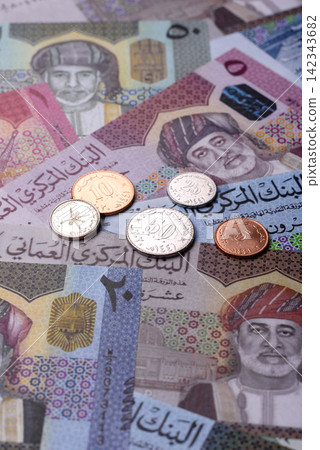 Oman, omani paper money, rial or riyal banknotes and coins as currency for exchange. Omani money Oman, omani paper money, rial or riyal banknotes and coins as currency for exchange. Omani money 142343682