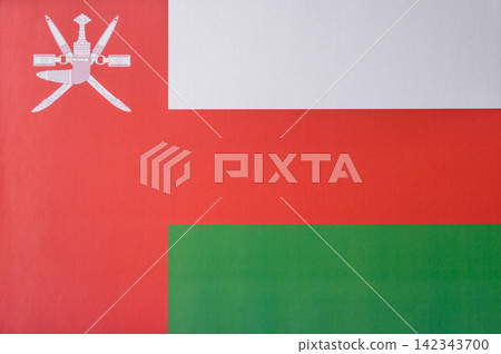 Oman, the Omani flag as a symbol of national independence. The Omani flag Oman, the Omani flag as a symbol of national independence. The Omani flag 142343700