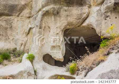 Amazing Volcanic rock formations known as Love Valley or Fairy Chimneys in Cappadocia, Turkey. Mushroom Valley one of attractions in Goreme National Park, Turkey. Mountains with rooms inside Amazing Volcanic rock formations known as Love Valley or Fairy Chimneys in Cappadocia, Turkey. Mushroom Valley one of attractions in Goreme National Park, Turkey. Mountains with rooms inside 142343777