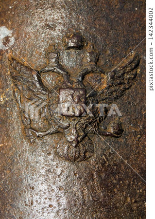 Coat of arms of the Russian Empire on old cannons in Kyiv fortress, a complex of Russian fortifications in Ukrainian capital built over the span of 17-19th centuries. Coat of arms of the Russian Empire on old cannons in Kyiv fortress, a complex of Russian fortifications in Ukrainian capital built over the span of 17-19th centuries. 142344002