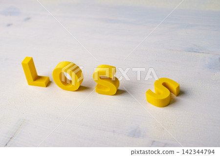 Financial loss, business failure and setback concept with fallen letter Financial loss, business failure and setback concept with fallen letter 142344794