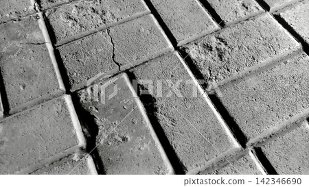 Cracked black and white concrete paving block texture Cracked black and white concrete paving block texture 142346690