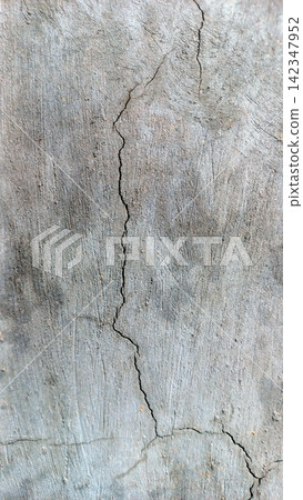 Vertical cracks in the texture of a weathered concrete wall. Vertical cracks in the texture of a weathered concrete wall. 142347952