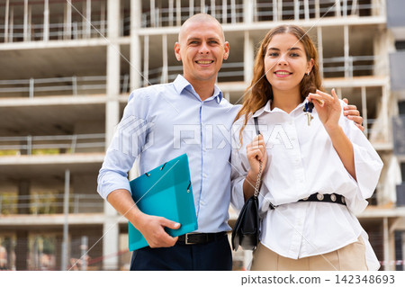 Portrait of a happy young couple who received the keys to a flat Portrait of a happy young couple who received the keys to a flat 142348693
