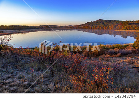 Autumn morning mist over Taoshan Lake, Bashang grassland, Chengde, Hebei, China Autumn morning mist over Taoshan Lake, Bashang grassland, Chengde, Hebei, China 142348794