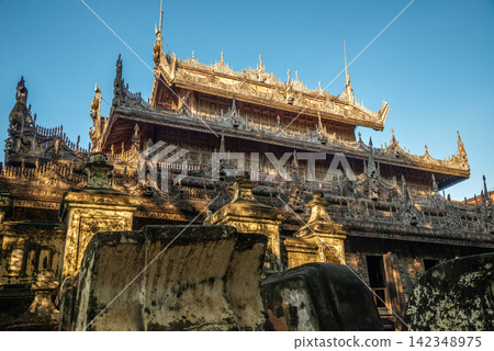 Beautiful view of Shwenandaw Monastery (Golden palace) the teak monastery originally part of the Royal Palace in Mandalay region of Myanmar. Beautiful view of Shwenandaw Monastery (Golden palace) the teak monastery originally part of the Royal Palace in Mandalay region of Myanmar. 142348975