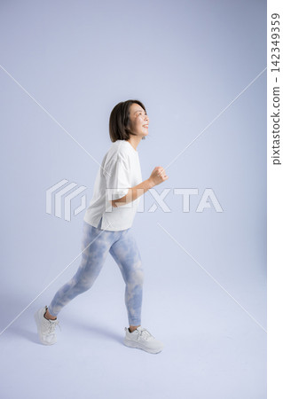 Women enjoying running and walking with smiles on their faces; active women in their 40s exercising to maintain their health. Women enjoying running and walking with smiles on their faces; active women in their 40s exercising to maintain their health. 142349359