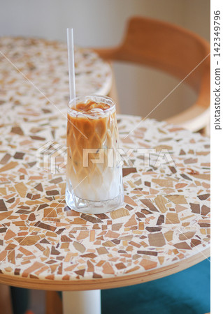 Coffee drink on a table in a cafe setting Coffee drink on a table in a cafe setting 142349796