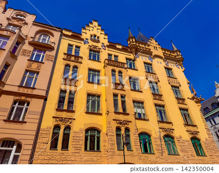 Old building in a city with blue sky in the background Old building in a city with blue sky in the background 142350004