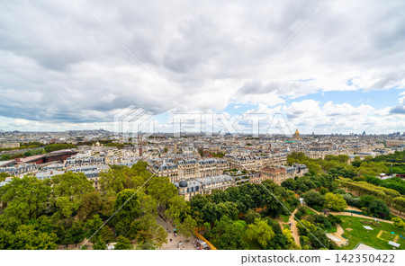Panoramic aerial view of paris cityscape with green park under cloudy sky in france Panoramic aerial view of paris cityscape with green park under cloudy sky in france 142350422