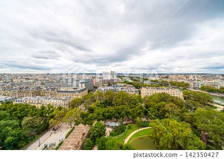 Panoramic aerial view of seine river and paris cityscape under cloudy sky in france Panoramic aerial view of seine river and paris cityscape under cloudy sky in france 142350427