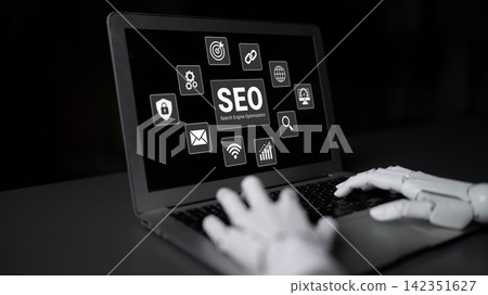 Robotic Hand Interacting with Laptop Displaying SEO Icons and Elements in Dark Environment for Digital Marketing and Technology Concepts Ledger Robotic Hand Interacting with Laptop Displaying SEO Icons and Elements in Dark Environment for Digital Marketing and Technology Concepts Ledger 142351627