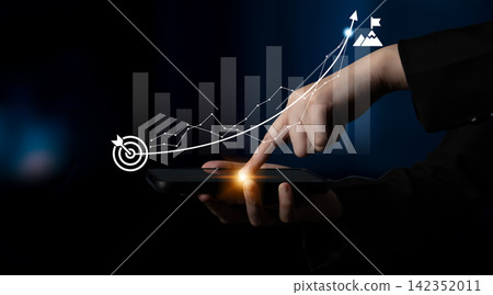 Businessman Using Smartphone to Analyze Data Trends with Graph and Arrow Illustrations Representing Growth and Success in Digital Environment Ledger Businessman Using Smartphone to Analyze Data Trends with Graph and Arrow Illustrations Representing Growth and Success in Digital Environment Ledger 142352011