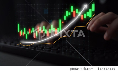 Digital Stock Market Graph Display on Computer Screen Showing Growth Trend with Green and Red Candlestick Patterns and Hands Close-Up on Keyboard Copula 142352335