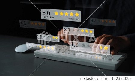 Hands Typing on Keyboard with Overlay of Customer Ratings and Feedback Scores in Different Star Ratings on Dark Background Gluon Hands Typing on Keyboard with Overlay of Customer Ratings and Feedback Scores in Different Star Ratings on Dark Background Gluon 142353092