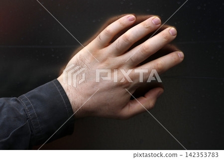 Hand of an adult man Hand of an adult man 142353783