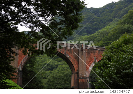 A carefree journey through Gunma Prefecture (The red brick arch bridge, a testament to the engineering and beauty of the former Usui Pass Railway, is affectionately known as "Meganebashi" (Spectacles Bridge).) A carefree journey through Gunma Prefecture (The red brick arch bridge, a testament to the engineering and beauty of the former Usui Pass Railway, is affectionately known as "Meganebashi" (Spectacles Bridge).) 142354767