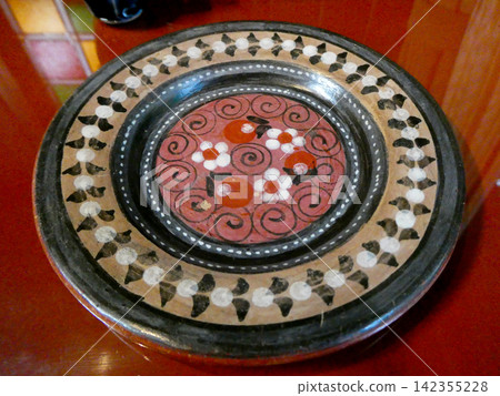 Mexican Tonalá pottery is used as a pastry dish or wall hanging. 142355228
