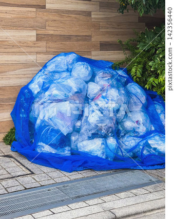 Images of garbage collection points that can be used to raise awareness of proper garbage disposal etiquette in apartment buildings and municipalities. 142356440