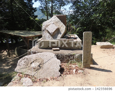 A stone monument located within the Tsukuriyama Kofun, a keyhole-shaped burial mound from the middle of the Kofun period in Okayama City, at the Arakoji Shrine. A stone monument located within the Tsukuriyama Kofun, a keyhole-shaped burial mound from the middle of the Kofun period in Okayama City, at the Arakoji Shrine. 142356696