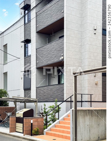 Exterior view of a modern and clean low-rise rental apartment building (real estate investment/mortgage image) Exterior view of a modern and clean low-rise rental apartment building (real estate investment/mortgage image) 142356790