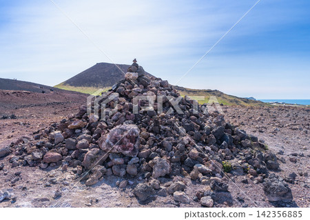 Volcanic landscape and lava rock pile in Heimaey, Iceland Volcanic landscape and lava rock pile in Heimaey, Iceland 142356885