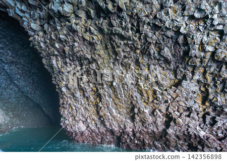 Basalt rock cave formation in Vestmannaeyjar, Iceland Basalt rock cave formation in Vestmannaeyjar, Iceland 142356898