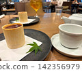 Dessert and coffee placed on the cafe table 142356979