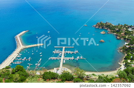 Aerial view of a picturesque bay with a yacht harbor and coastal resort Aerial view of a picturesque bay with a yacht harbor and coastal resort 142357092