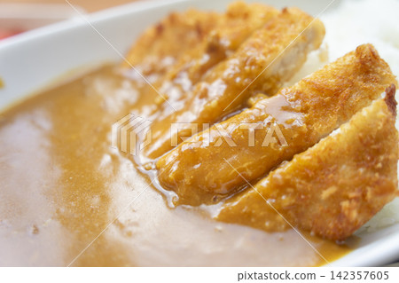 Close Up of Crispy Pork Cutlet with Curry Sauce Close Up of Crispy Pork Cutlet with Curry Sauce 142357605