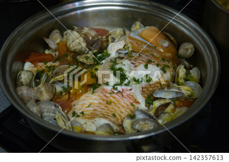 Acqua Pazza is a classic home-style dish. Acqua Pazza is a classic home-style dish. 142357613