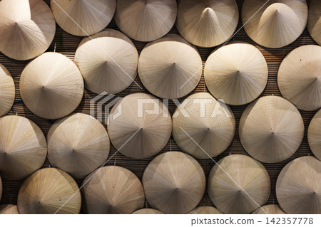 A display of traditional Vietnamese conical hats Non La A display of traditional Vietnamese conical hats Non La 142357778