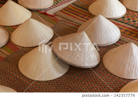Rows of traditional Vietnamese conical hats Non La Rows of traditional Vietnamese conical hats Non La 142357779